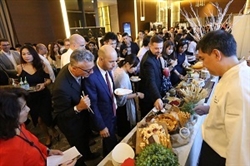 Guests enjoying U.S. cheeses at opening ceremonies